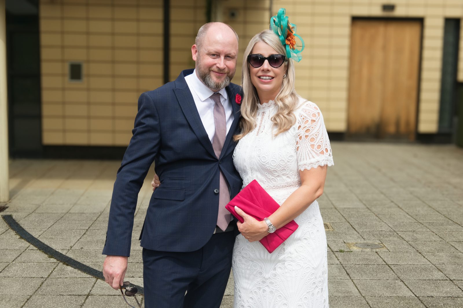 Well-dressed couple posing for a portrait at the event