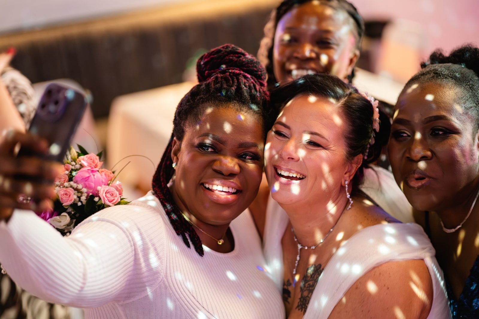Joyful guests taking a selfie on the dance floor